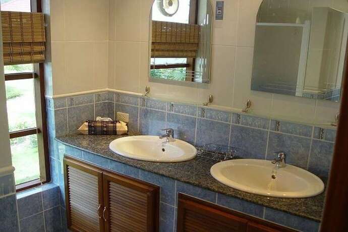Imagen de la habitación del Hotel Swiss Orchid Private Bungalow Resort. Foto 13