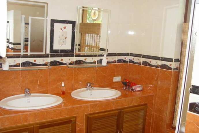Imagen de la habitación del Hotel Swiss Orchid Private Bungalow Resort. Foto 15