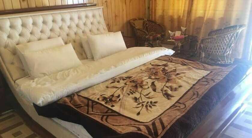 Imagen de la habitación del Hotel Swiss Wood Cottages. Foto 19