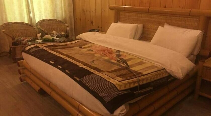 Imagen de la habitación del Hotel Swiss Wood Cottages. Foto 20
