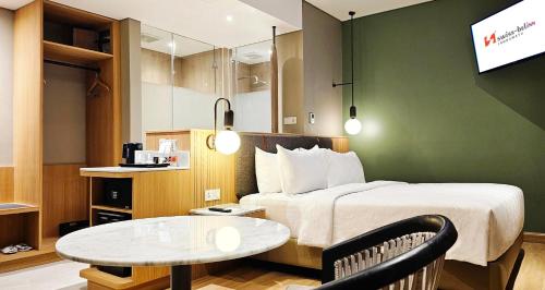 Imagen de la habitación del Hotel Swiss-Belinn Indramayu. Foto 19
