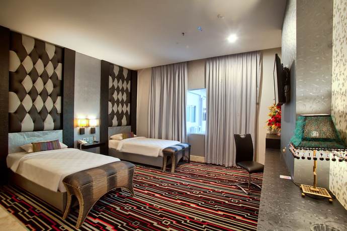 Imagen de la habitación del Hotel Swiss-belcourt Makassar. Foto 4