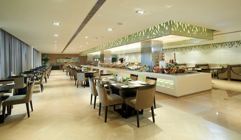 Imagen del bar/restaurante del Hotel Swiss-belhotel Liyuan Wuxi. Foto 2