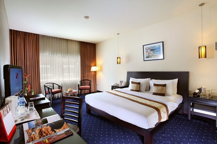 Imagen de la habitación del Hotel Swiss-belhotel Silae Palu. Foto 7