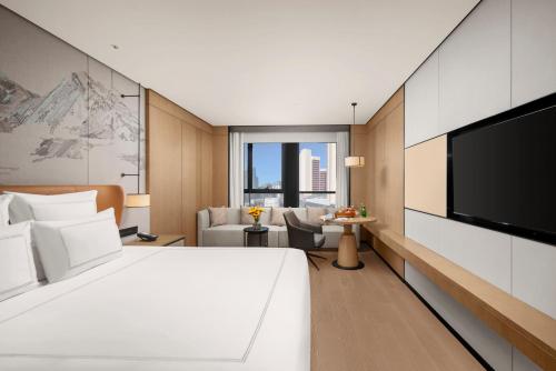 Imagen de la habitación del Hotel Swissôtel Beijing Hong Kong Macau Center. Foto 17