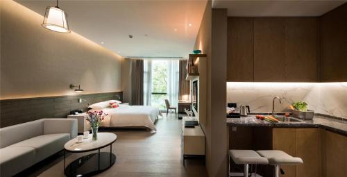 Imagen de la habitación del Hotel Swisstouches Guangzhou Residences. Foto 6