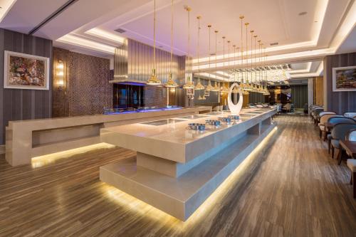 Imagen del bar/restaurante del Hotel Swisstouches Xian. Foto 3