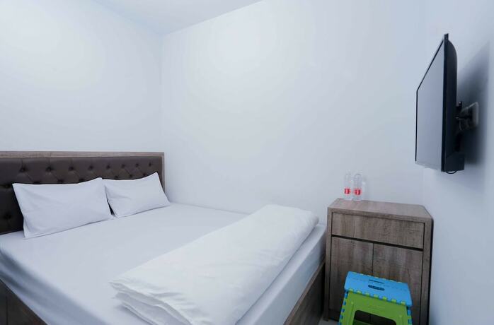 Imagen de la habitación del Hotel Syariah Amethyst Cengkareng. Foto 17