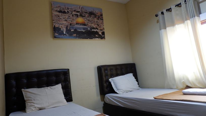 Imagen de la habitación del Hotel Syariah Larismanis. Foto 7