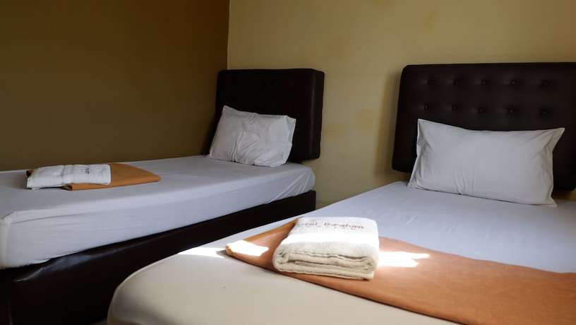 Imagen de la habitación del Hotel Syariah Larismanis. Foto 9