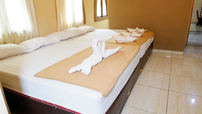 Imagen de la habitación del Hotel Syariah Larismanis. Foto 10