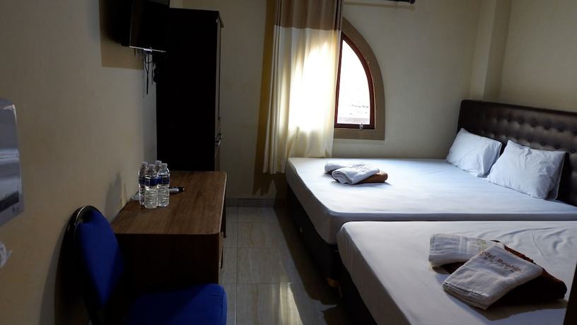 Imagen de la habitación del Hotel Syariah Larismanis. Foto 12