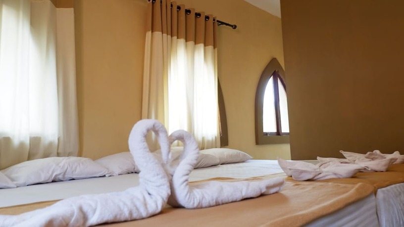 Imagen de la habitación del Hotel Syariah Larismanis. Foto 14