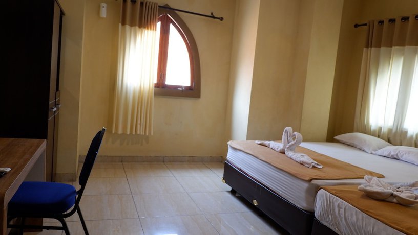 Imagen de la habitación del Hotel Syariah Larismanis. Foto 15