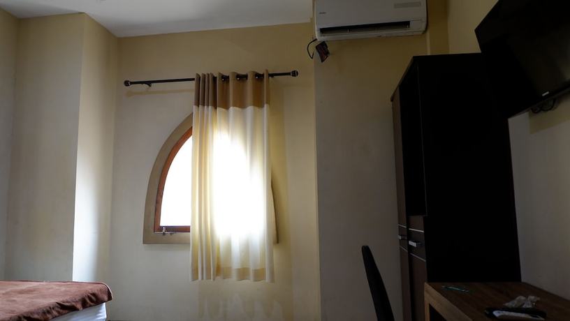 Imagen de la habitación del Hotel Syariah Larismanis. Foto 16
