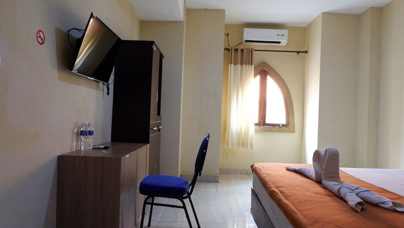 Imagen de la habitación del Hotel Syariah Larismanis. Foto 17