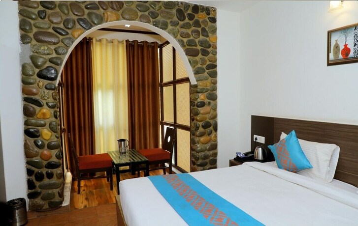 Imagen de la habitación del Hotel Symphony By Devbhoomi Corbett Resort. Foto 17