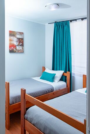 Imagen de la habitación del Hotel TAGLE APARTMENTS. Foto 14