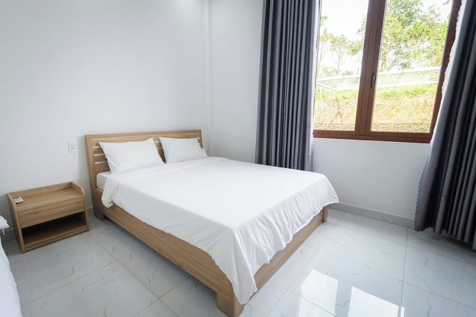 Imagen de la habitación del Hotel TAM CHAU FARM. Foto 11