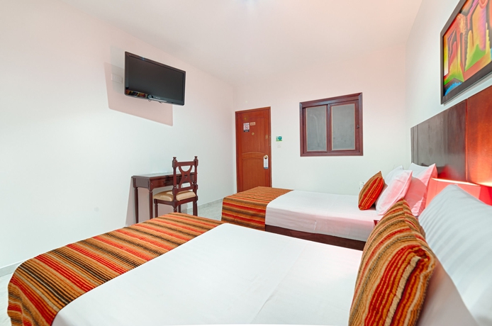 Imagen de la habitación del Hotel TAMA Granada Real Cali. Foto 9