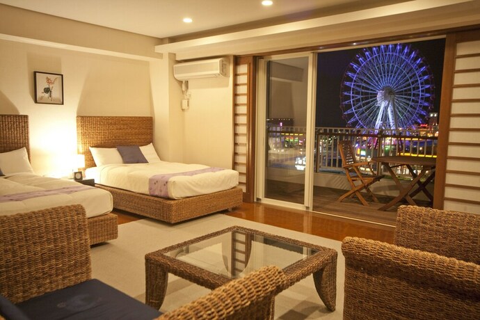 Imagen de la habitación del Hotel TATAMI NO YADO Chatan Mihama. Foto 19