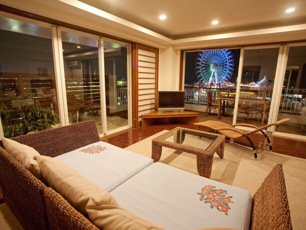 Imagen de la habitación del Hotel TATAMI NO YADO Chatan Mihama. Foto 20