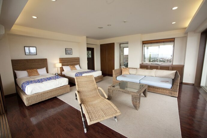 Imagen de la habitación del Hotel TATAMI NO YADO Chatan Mihama. Foto 21