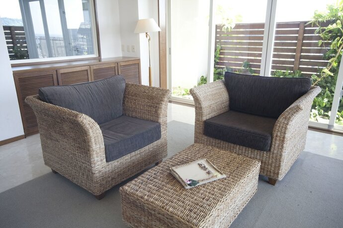 Imagen de la habitación del Hotel TATAMI NO YADO Chatan Mihama. Foto 22