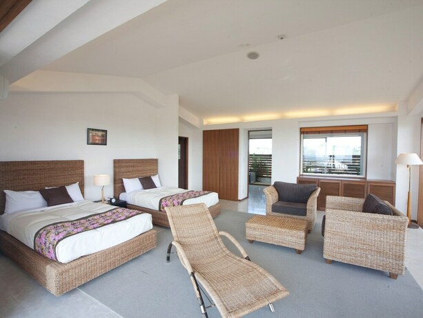 Imagen de la habitación del Hotel TATAMI NO YADO Chatan Mihama. Foto 24