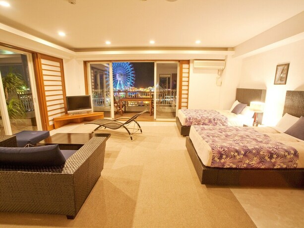 Imagen de la habitación del Hotel TATAMI NO YADO Chatan Mihama. Foto 26