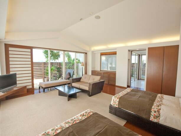 Imagen de la habitación del Hotel TATAMI NO YADO Chatan Mihama. Foto 27