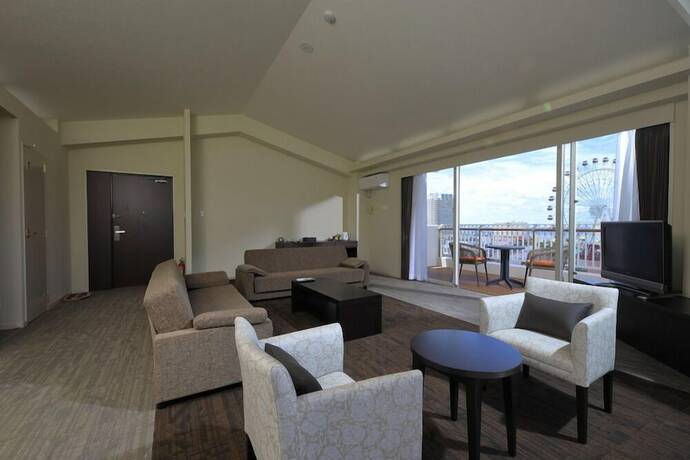 Imagen de la habitación del Hotel TATAMI NO YADO Chatan Mihama. Foto 28