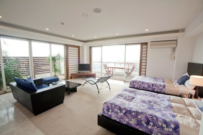 Imagen de la habitación del Hotel TATAMI NO YADO Chatan Mihama. Foto 29
