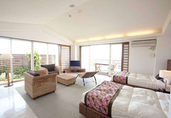 Imagen de la habitación del Hotel TATAMI NO YADO Chatan Mihama. Foto 31