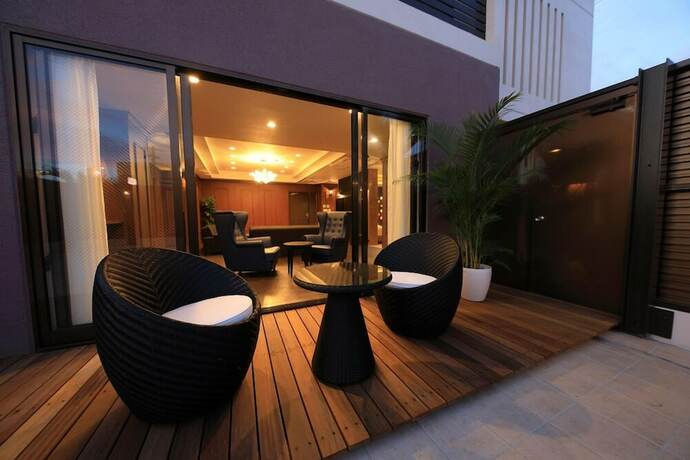 Imagen de la habitación del Hotel TATAMI NO YADO Chatan Mihama. Foto 32