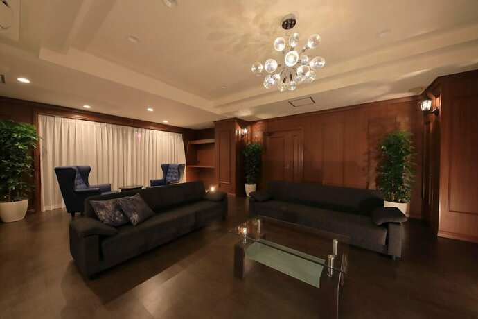 Imagen de la habitación del Hotel TATAMI NO YADO Chatan Mihama. Foto 35