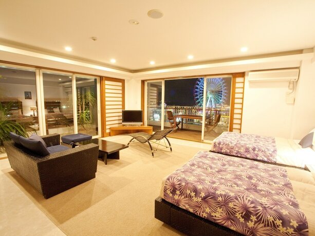 Imagen de la habitación del Hotel TATAMI NO YADO Chatan Mihama. Foto 37