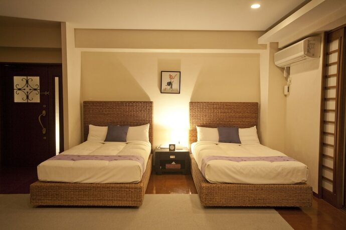 Imagen de la habitación del Hotel TATAMI NO YADO Chatan Mihama. Foto 39