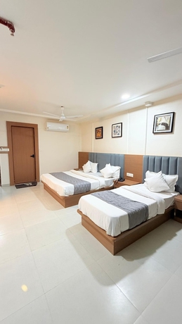 Imagen de la habitación del Hotel TGR Bharuch. Foto 4