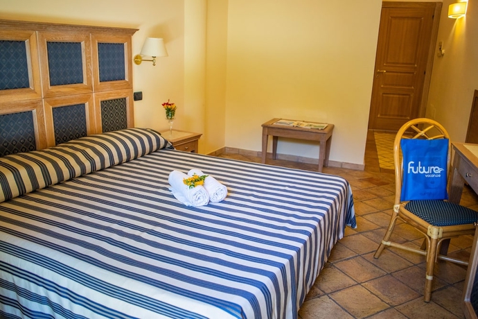Imagen de la habitación del Hotel TH Le Castella - Baia degli Dei Village. Foto 7