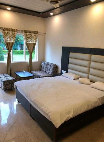 Imagen de la habitación del Hotel THE PALMS RESORT, Dehradun. Foto 13