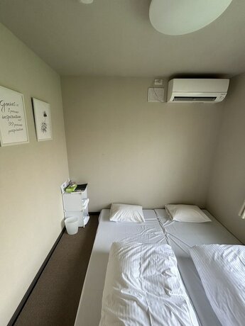 Imagen de la habitación del Hotel THE TOYA. Foto 17
