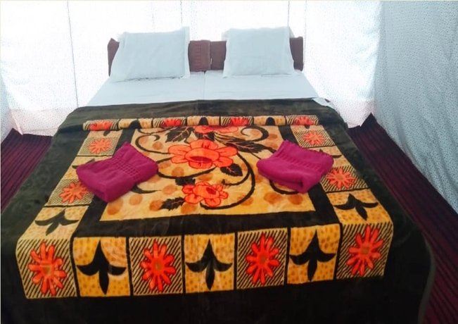 Imagen de la habitación del Hotel TIH Julley World Camp. Foto 9