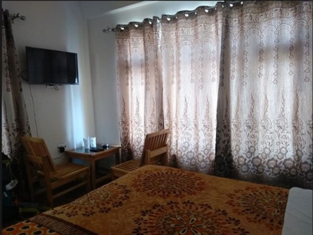 Imagen de la habitación del Hotel TIH Wang Residency. Foto 7