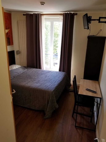 Imagen de la habitación del Hotel TINGIS, París. Foto 8