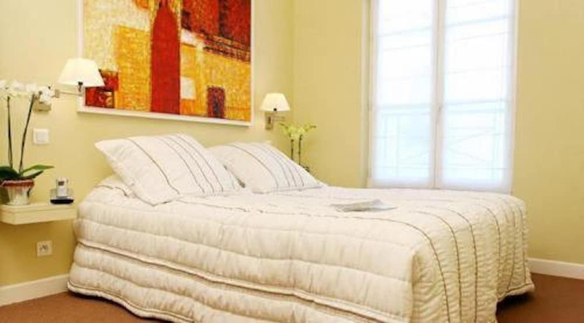 Imagen de la habitación del Hotel TINGIS, París. Foto 15