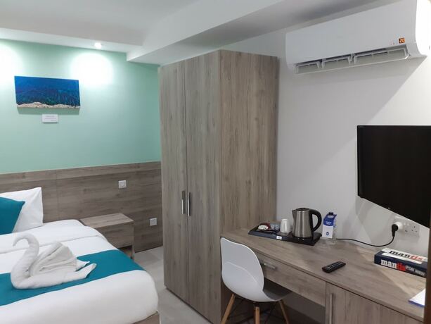 Imagen de la habitación del Hotel TJ Boutique Accommodation. Foto 15