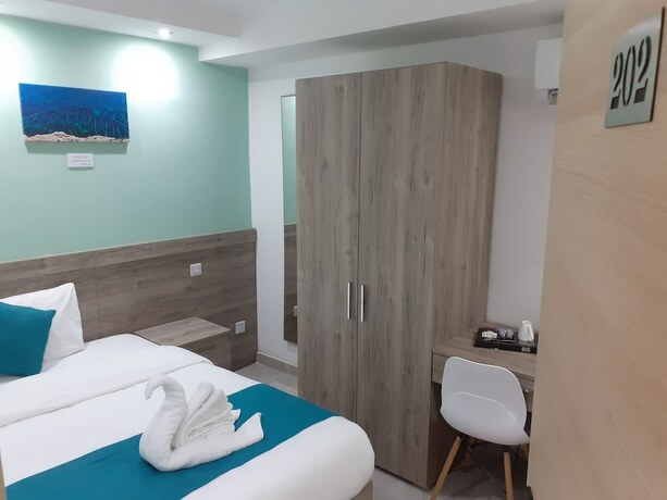 Imagen de la habitación del Hotel TJ Boutique Accommodation. Foto 16