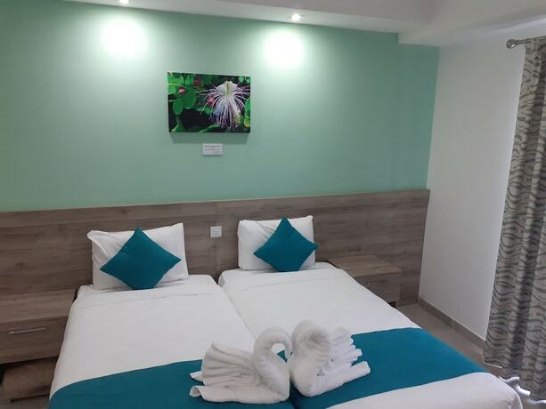 Imagen de la habitación del Hotel TJ Boutique Accommodation. Foto 18