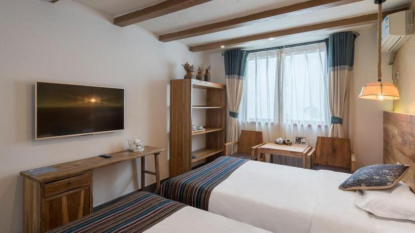 Imagen de la habitación del Hotel TONGXIANG WUZHEN YUEXIANG INN, Huangjiadi. Foto 4